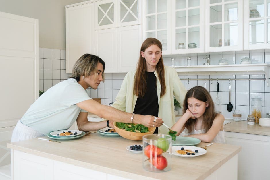 Family preparing a meal together in a well-equipped modern kitchen on holiday