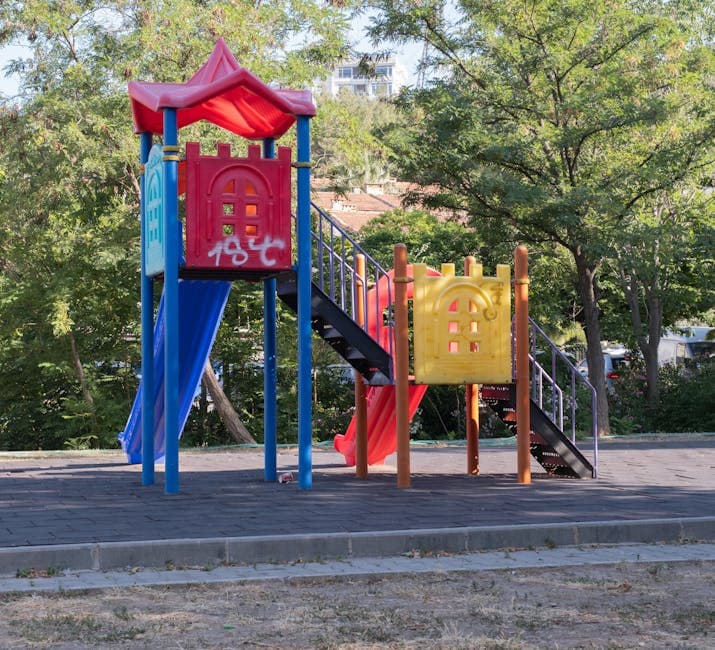 Vibrant playground equipment in a sunny park, ideal for children's outdoor activities