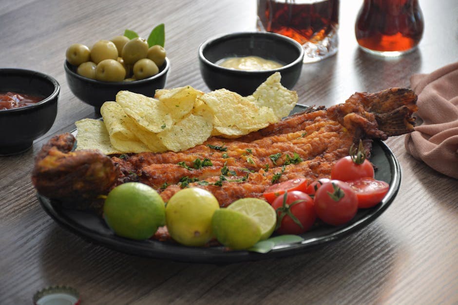 Classic British fish and chips with golden battered fish and thick-cut chips served on a wooden table