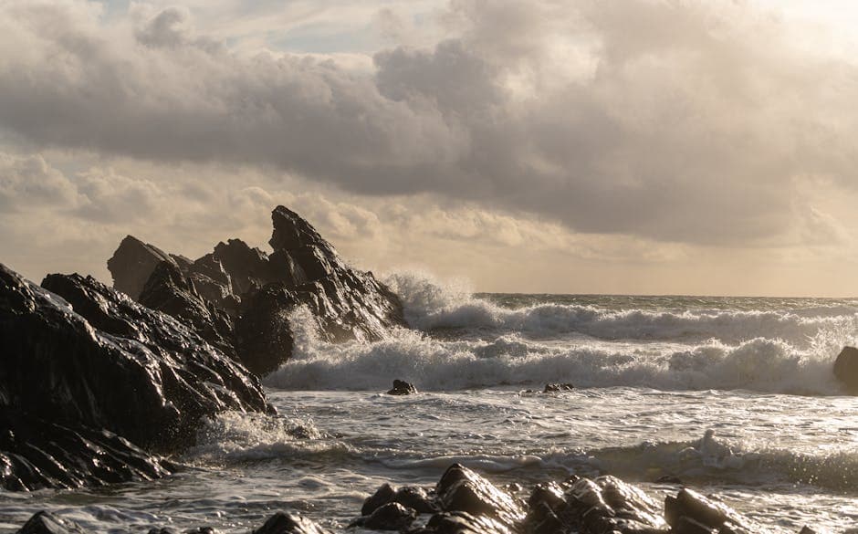 Dramatic waves crashing against rocky shores on a wild winter coastline