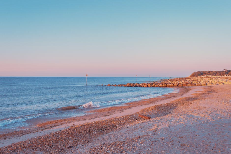 The view from Hengistbury Head across Christchurch Harbour towards Mudeford Sandbank with the Isle of Wight visible in the distance