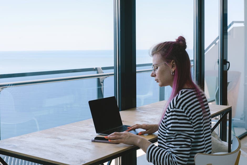 Bournemouth apartment desk setup with sea view through the window